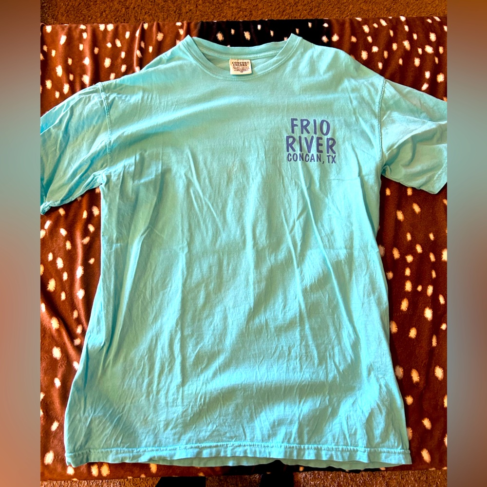 Frio tshirt, bright with colorful feathers on the back.